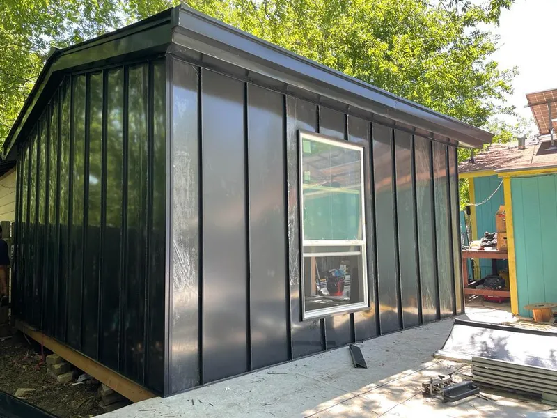 Black standing seam metal wall panels for Roof Inspection in Mila Doce