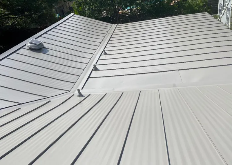 Solar attic fan installed on a metal roof for Roof Ventilation in Mila Doce